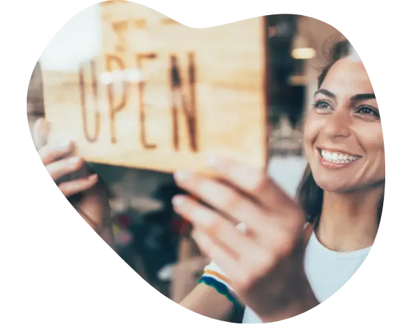 woman open sign on business QSEHRA