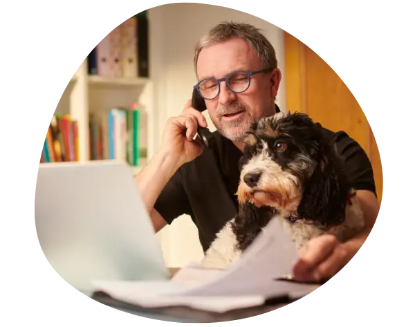 Businessman working from home with dog ICHRA