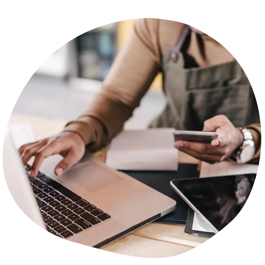 close up of person calculating benefits for small business