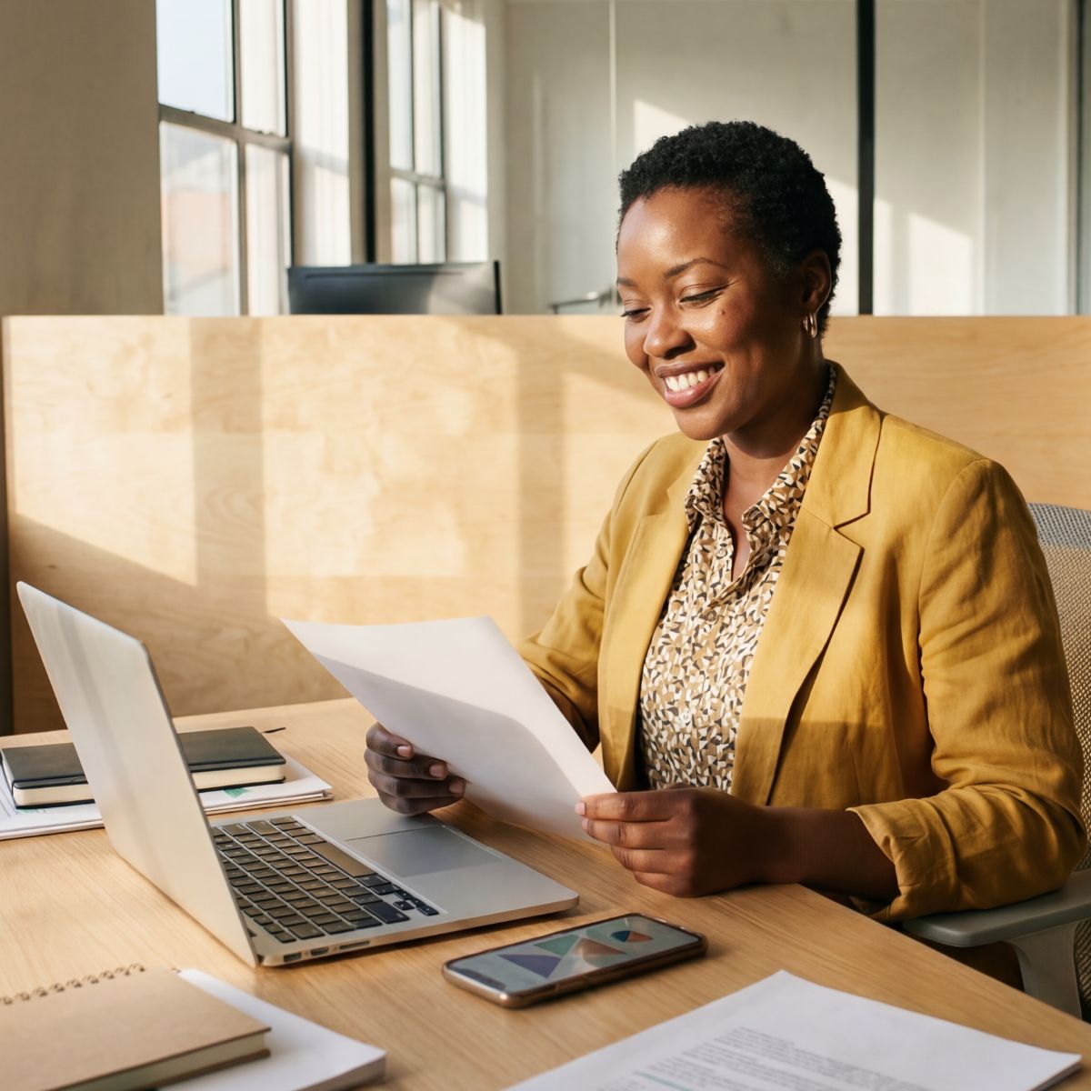 TPA services woman at desk looking over insurance paperwork