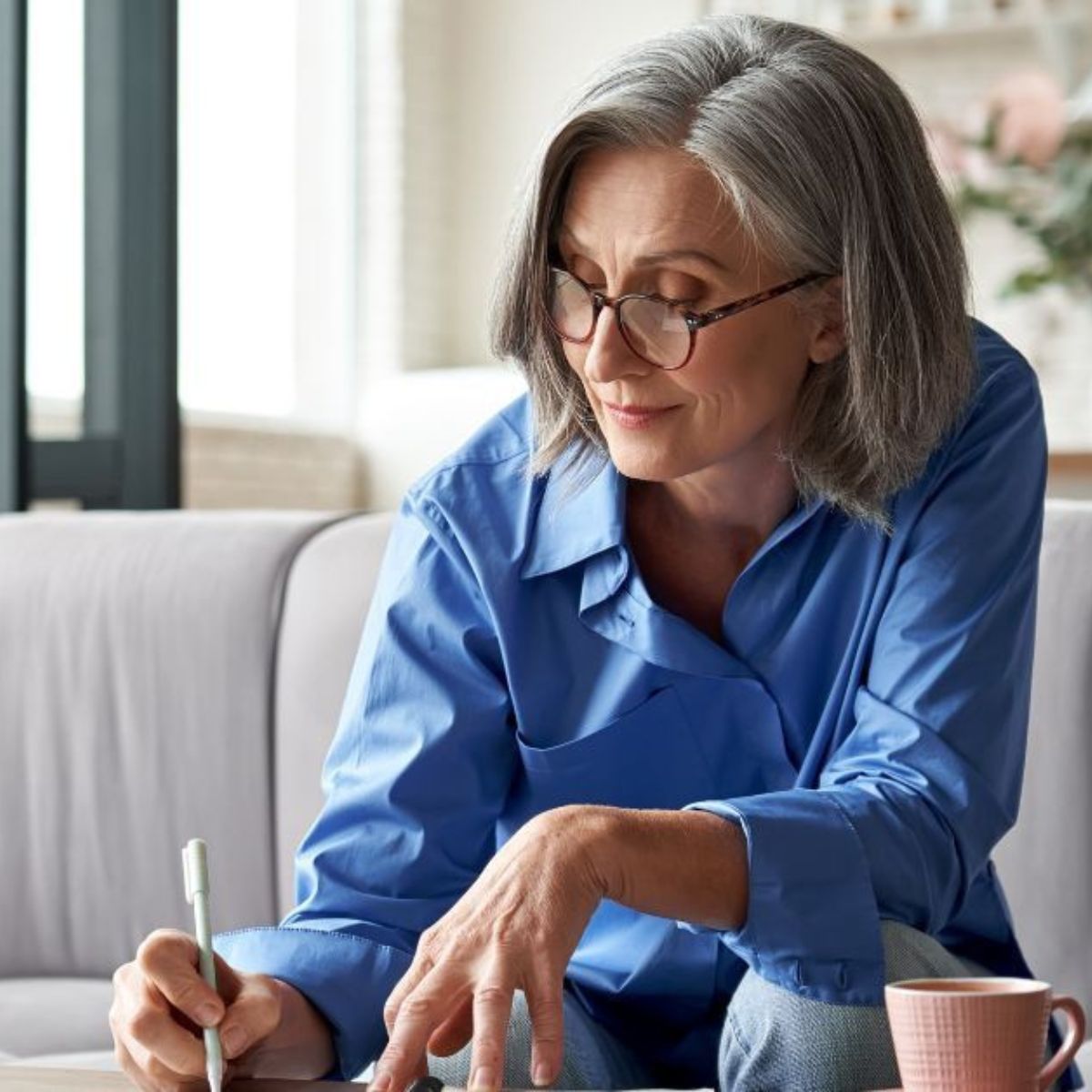 Medicare woman filling out enrollment paperwork